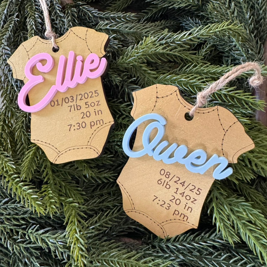 Baby's First Holiday Onesie Ornament with gold, pink, blue